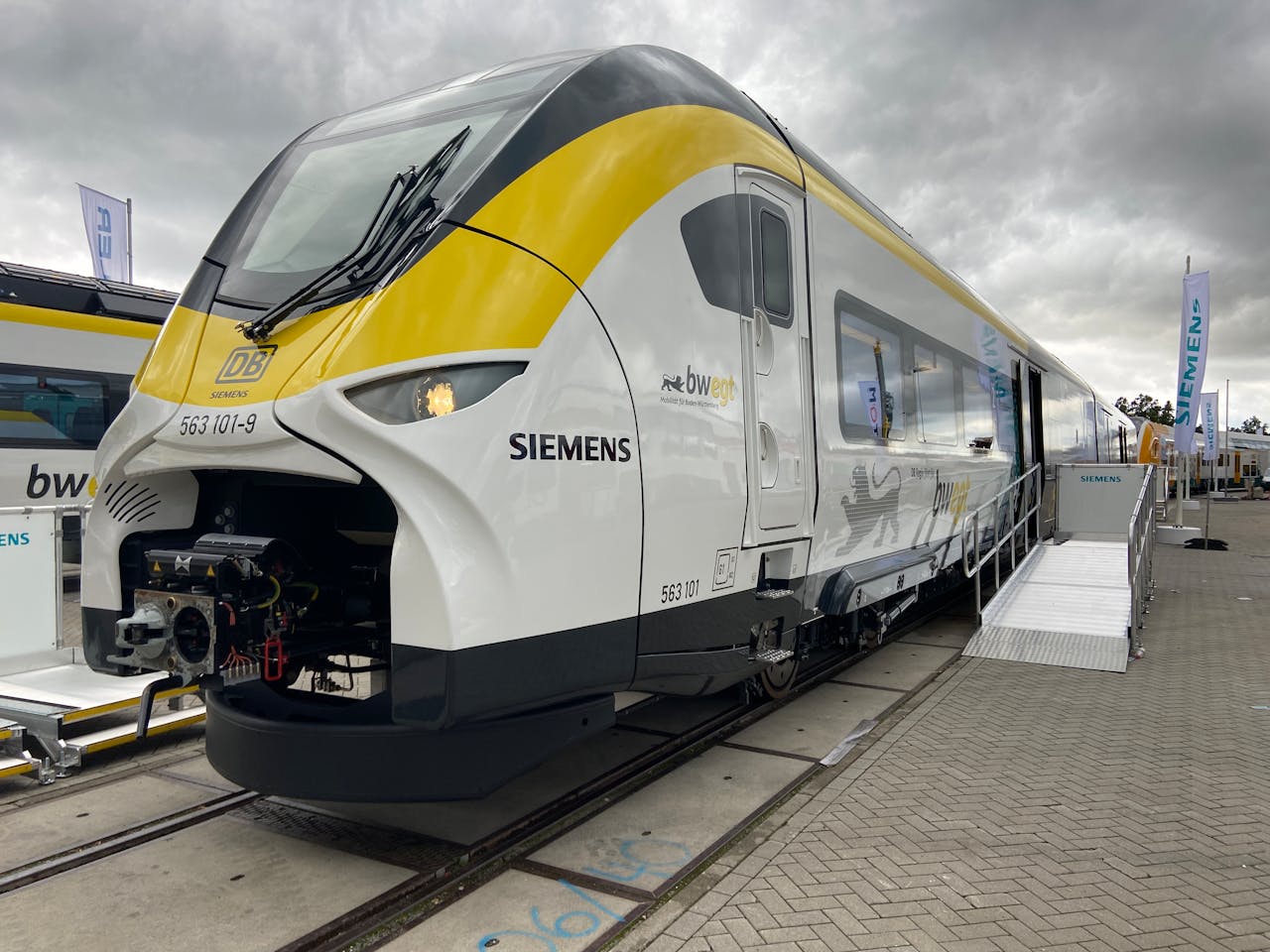 Contemporary Siemens train on display at a Berlin station, showcasing advanced design and transportation technology.